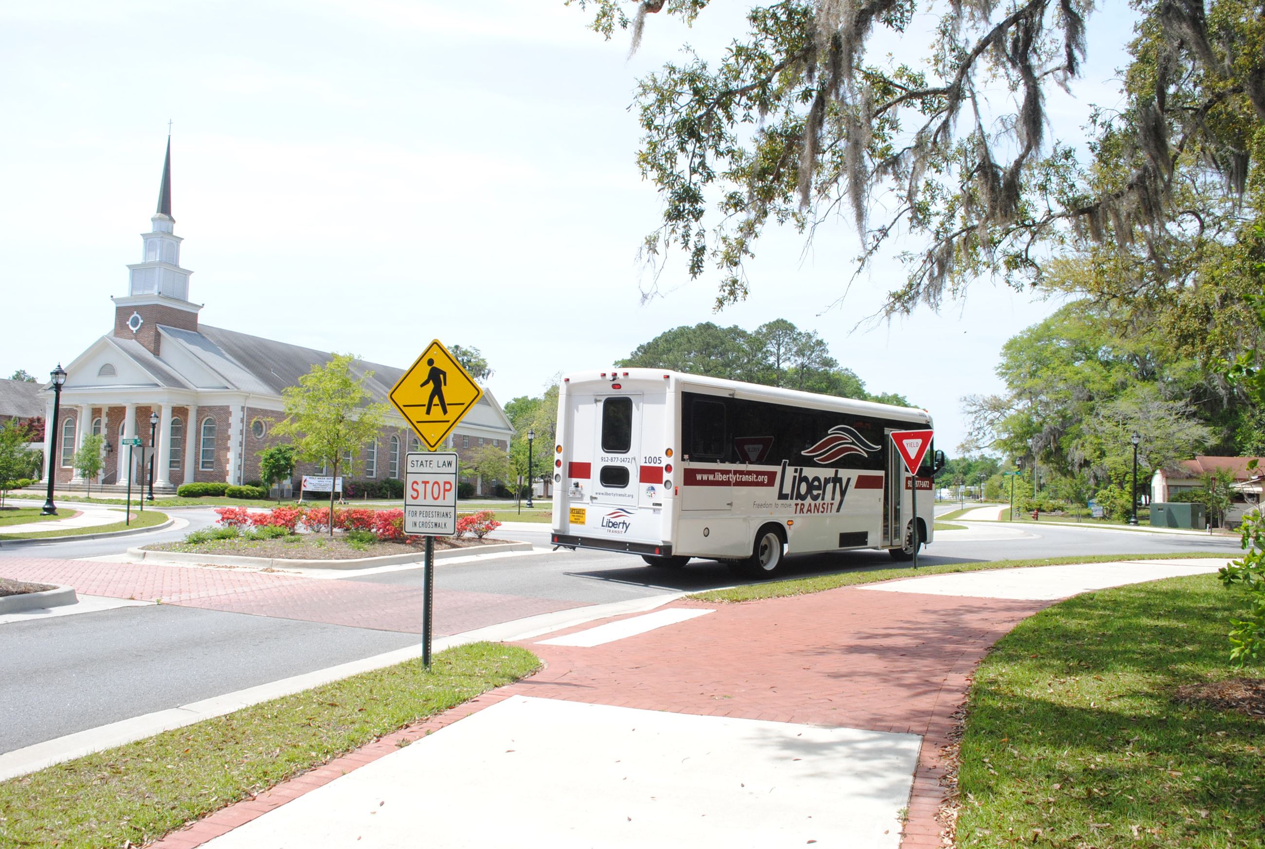 Liberty Transit Bus Moving Through Roundabout